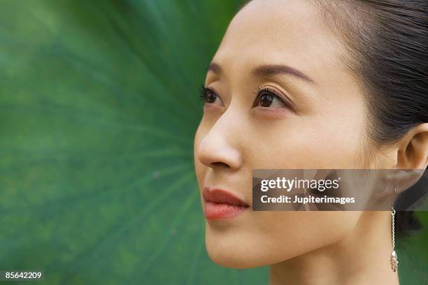 side view of woman - asia orientale foto e immagini stock