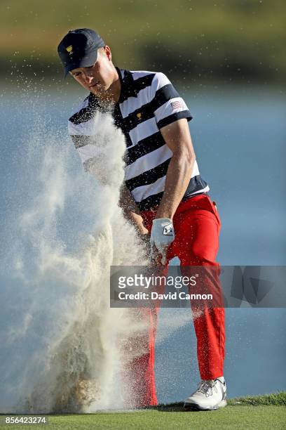 Jordan Spieth of the United States plays his fourth shot on the 14th hole in his match against Jhonattan Vegas of the International Team during the...