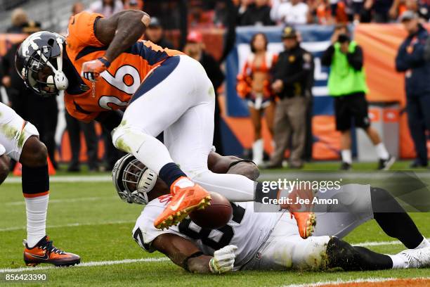 Darian Stewart of the Denver Broncos breaks up a would be touchdown pass intended for Jared Cook of the Oakland Raiders during the fourth quarter on...