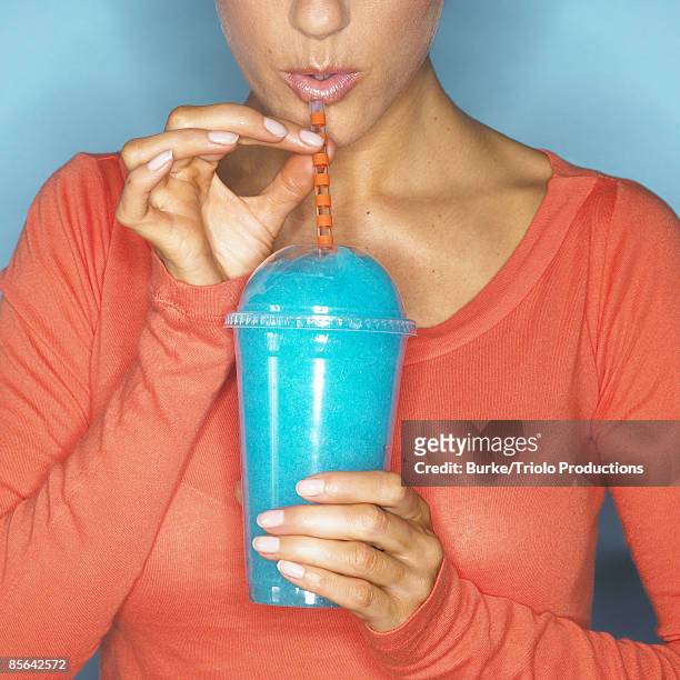 woman sipping ice blended drink - frozen drink foto e immagini stock