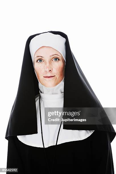 portrait of nun wearing rosary - nun habit stock pictures, royalty-free photos & images