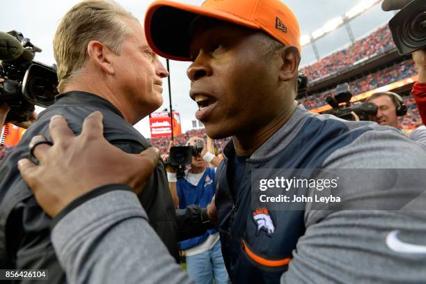 Head coach Vance Joseph of the Denver Broncos shakes hands with head coach Jack Del Rio of the Oakland Raiders after the Denver Broncos won 16-10....