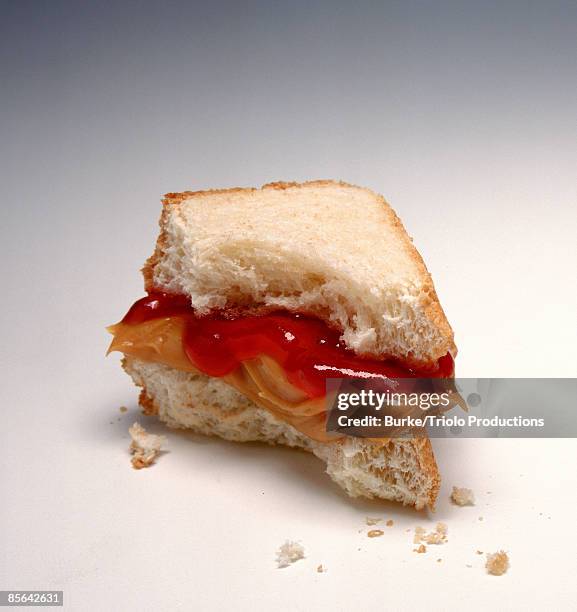 half eaten peanut butter and jelly sandwich - peanut butter and jelly sandwich stock pictures, royalty-free photos & images