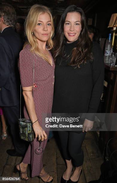 Sienna Miller and Liv Tyler attend a Grand Classics screening of Saturday Night Fever hosted by Sienna Miller, in association with THE OUTNET, at The...
