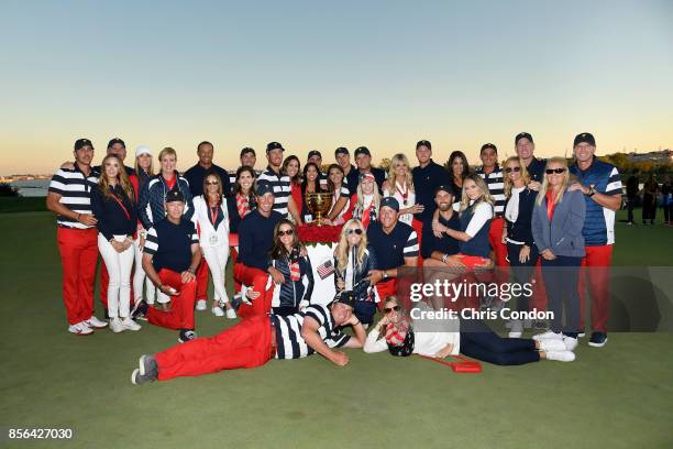 Members of the U.S. Team pose with the trophy after they defeated the International Team 19 to 11 in the Presidents Cup at Liberty National Golf Club...