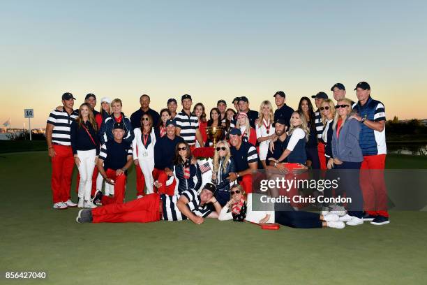 Members of the U.S. Team pose with the trophy after they defeated the International Team 19 to 11 in the Presidents Cup at Liberty National Golf Club...