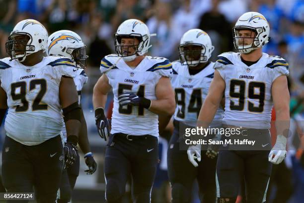 Brandon Mebane, Kyle Emanuel, Corey Liuget and Joey Bosa of the Los Angeles Chargers look on after a Philadelphia Eagles touchdown during the second...