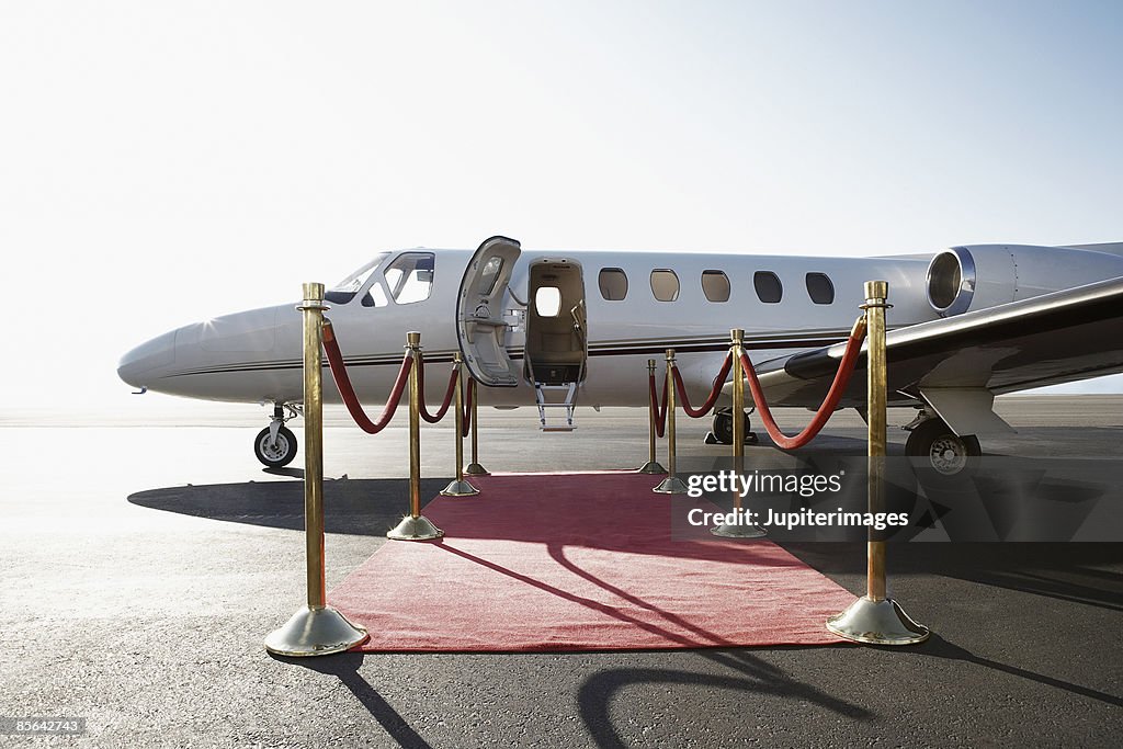 Private airplane with red carpet