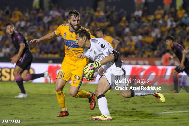 Andre Gignac of Tigres chases Rodolfo Cota, goalkeeper of Chivas, during the 12th round match between Tigres UANL and Chivas as part of the Torneo...