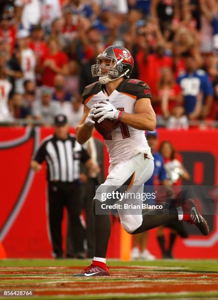 Tight end Cameron Brate of the Tampa Bay Buccaneers hauls in a 14-yard touchdown pass from quarterback Jameis Winston during the fourth quarter of an...