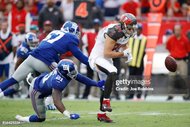 Landon Collins of the New York Giants breaks up a pass intended for Cameron Brate of the Tampa Bay Buccaneers in the fourth quarter of a game at...