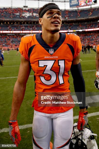 Justin Simmons of the Denver Broncos leaves the field after their win against the Oakland Raiders at Sports Authority Field at Mile High on October...