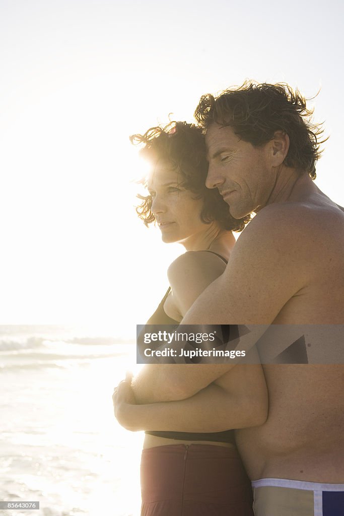 Couple embracing at beach