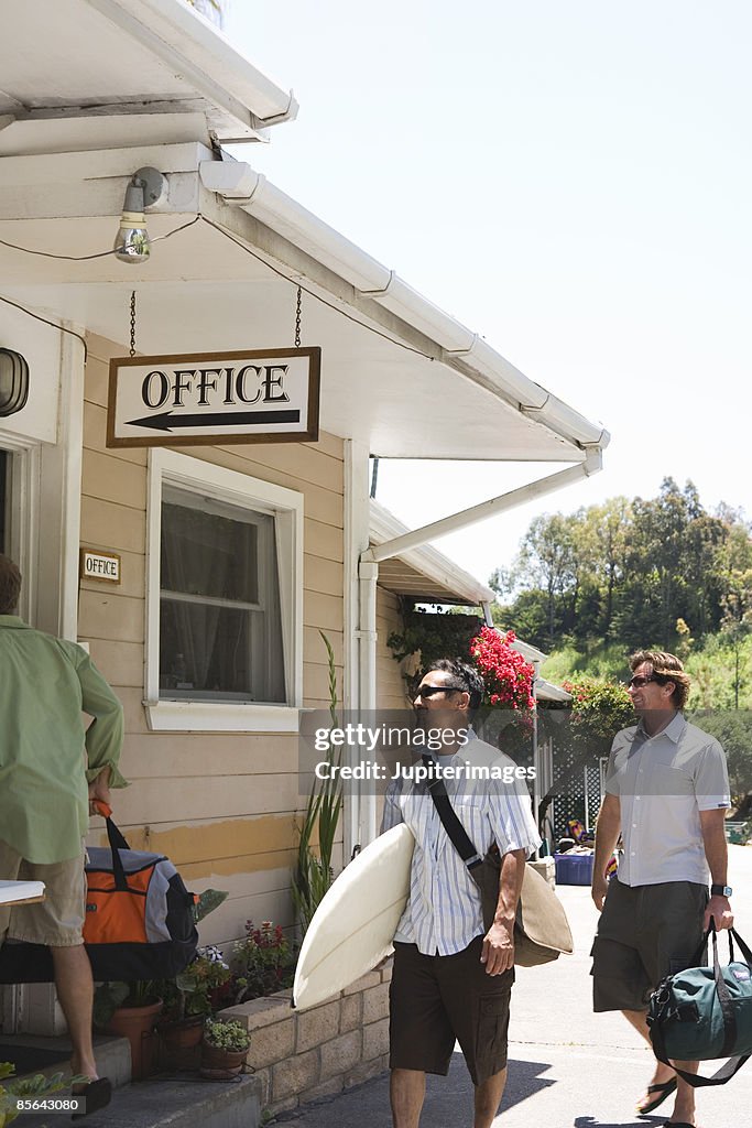 Surfers heading into motel office