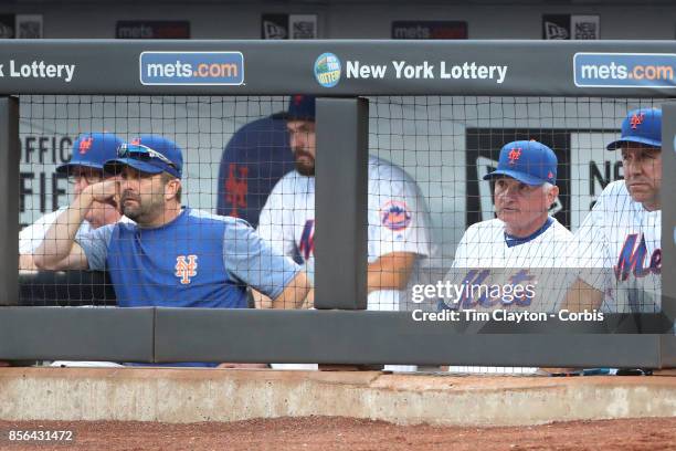 The new York Mets coaching staff watching play, from left, Dan Warthen of the New York Mets, Kevin Long of the New York Mets, Manager Terry Collins...