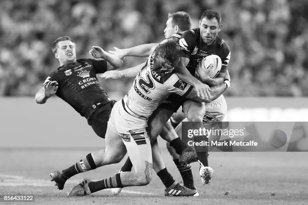 Cameron Smith of the Storm is tackled during the 2017 NRL Grand Final match between the Melbourne Storm and the North Queensland Cowboys at ANZ...