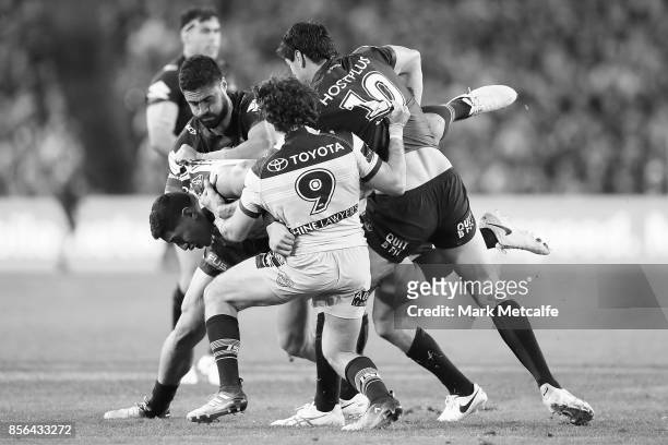 Jason Taumalolo of the Cowboys is tackled during the 2017 NRL Grand Final match between the Melbourne Storm and the North Queensland Cowboys at ANZ...