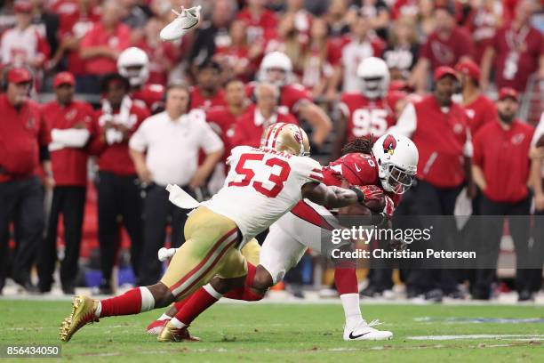 Middle linebacker NaVorro Bowman of the San Francisco 49ers tackles running back Andre Ellington of the Arizona Cardinals during overtime of the NFL...