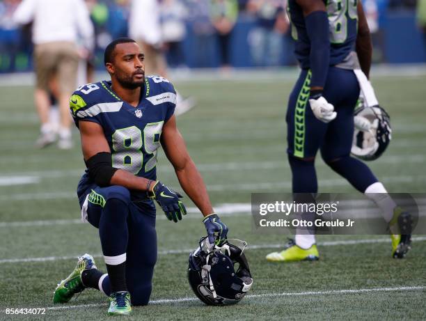 Wide receiver Doug Baldwin of the Seattle Seahawks kneels on the field before the game against the Indianapolis Colts at CenturyLink Field on October...