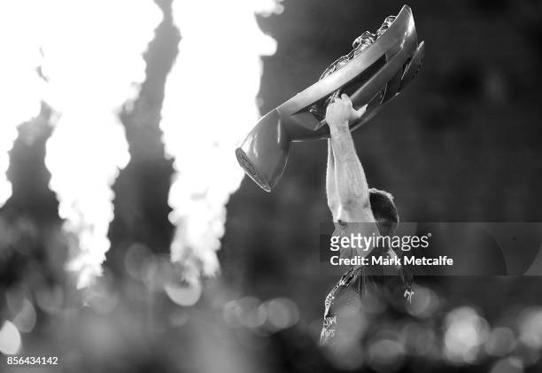 Cameron Smith of the Storm celebrates and holds aloft the NRL Premiership trophy after winning the 2017 NRL Grand Final match between the Melbourne...