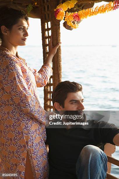 pensive couple on houseboat, india - pensive indian man stock pictures, royalty-free photos & images