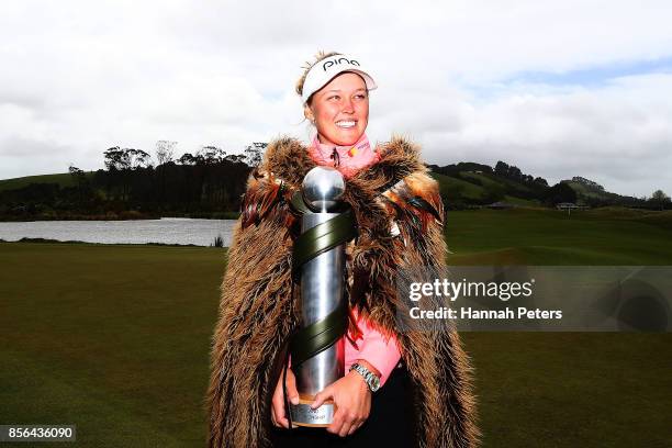 Brooke Henderson of Canada poses with the New Zealand Women's Open trophy by MC Kim during day five of the New Zealand Women's Open at Windross Farm...