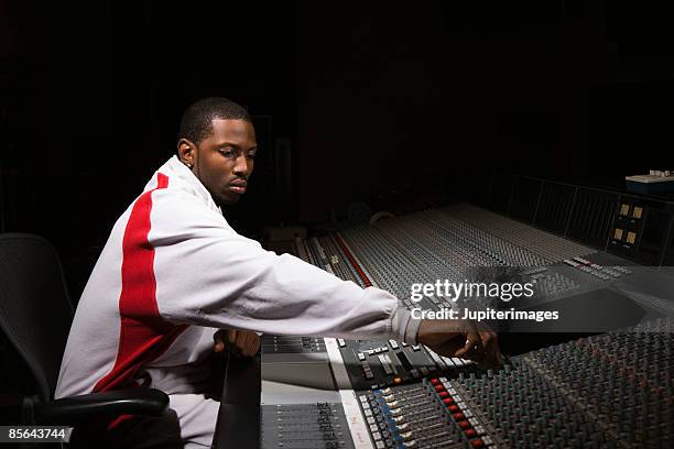 man using mixing board - producent stock-fotos und bilder