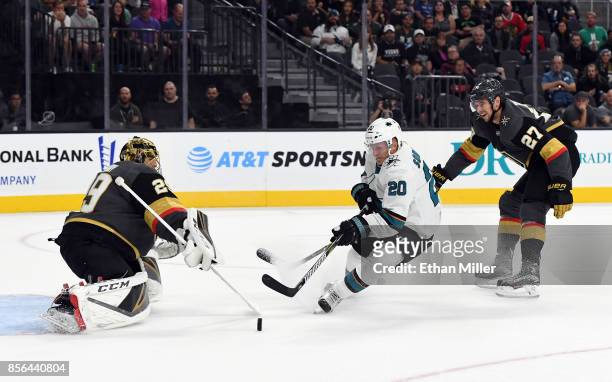 Marcus Sorensen of the San Jose Sharks scores a goal against Marc-Andre Fleury of the Vegas Golden Knights as Shea Theodore of the Knights defends in...