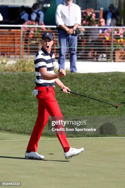 Golfer Daniel Berger reacts to making a birdie putt on the 14th hole during the final round of the Presidents Cup at Liberty National Golf Club on...