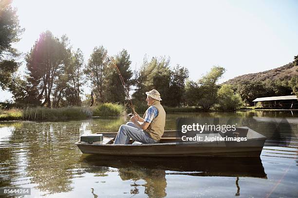 man fishing - rowboat bildbanksfoton och bilder