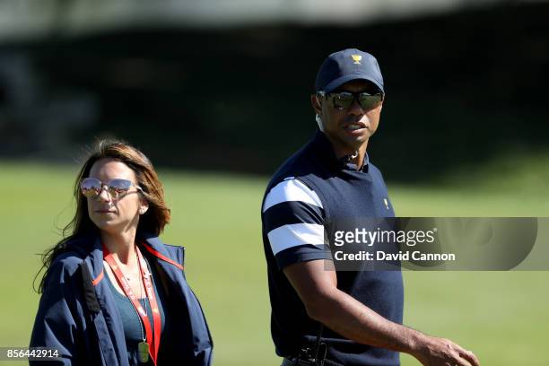 Tiger Woods one of the United States team assistant captain's on the first hole with Erica Herman during the final day singles matches matches in the...