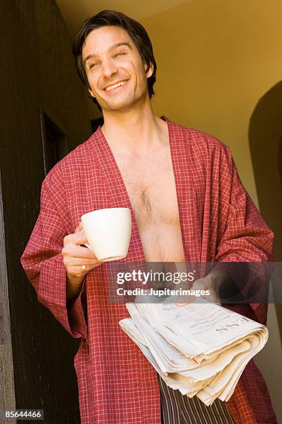 man with coffee and newspaper - open newspaper stock pictures, royalty-free photos & images