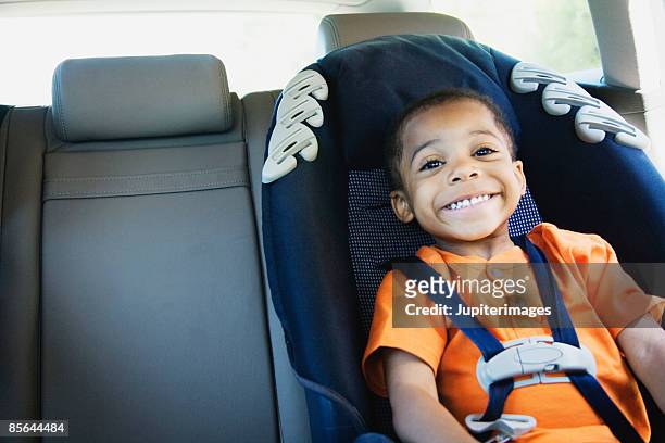 smiling boy - autositz stock-fotos und bilder
