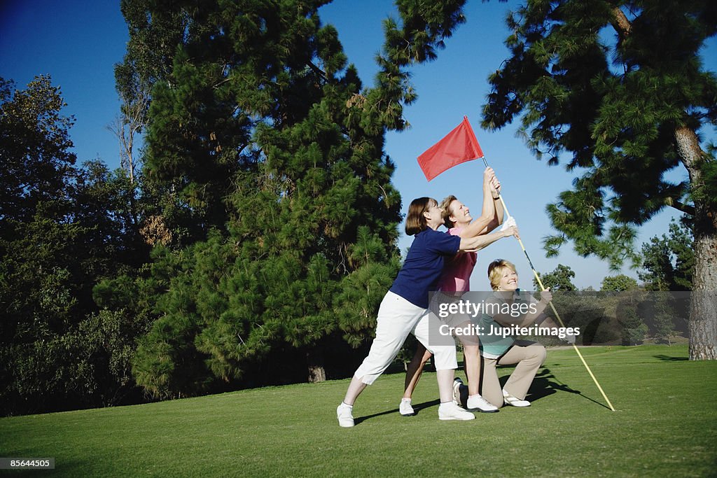 Women having fun on golf course