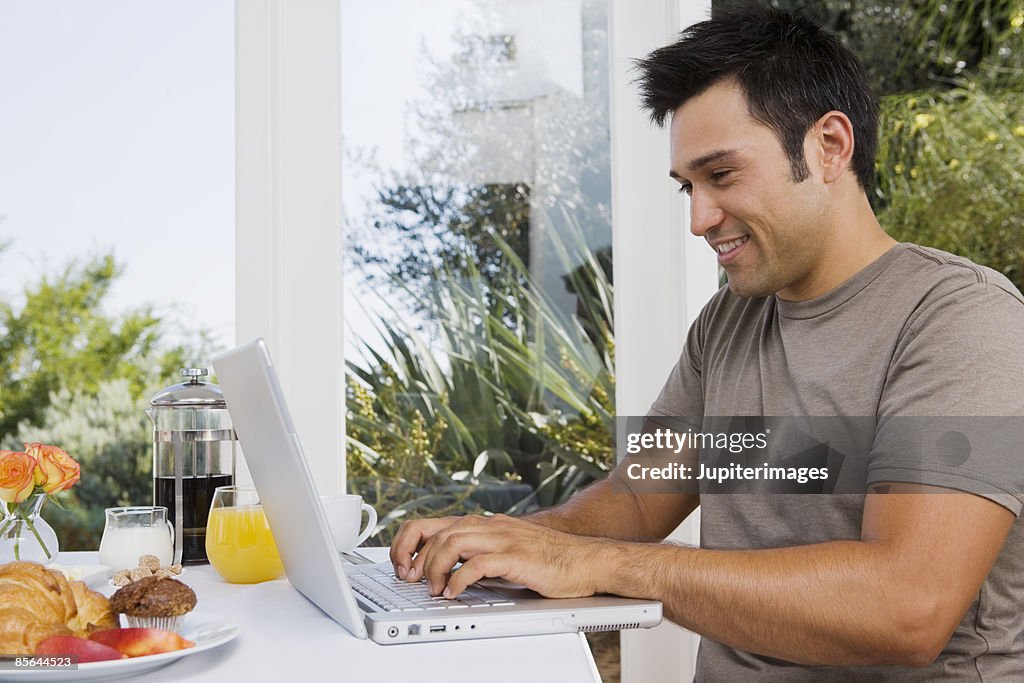 Man using laptop computer