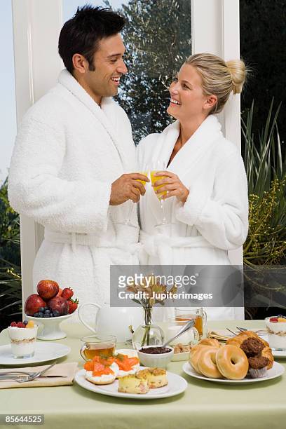 couple toasting with mimosas - mini quiche stock pictures, royalty-free photos & images