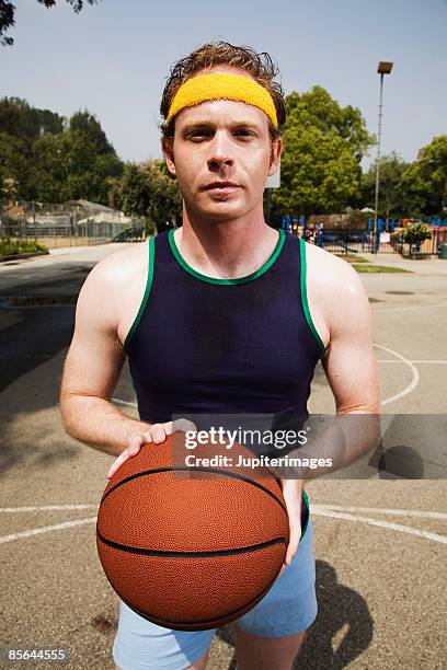 man with basketball - hair band stock pictures, royalty-free photos & images