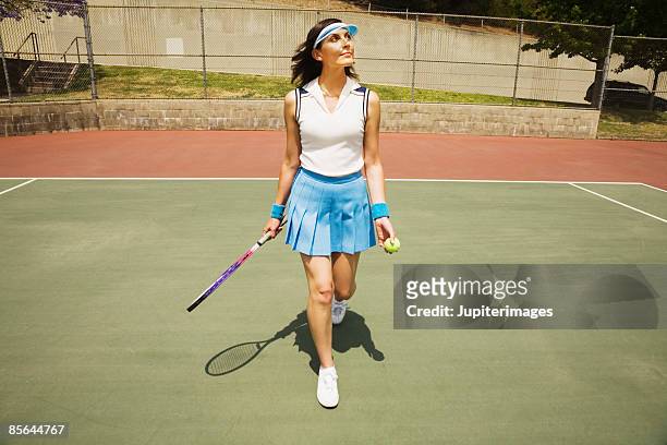 woman in tennis attire - atuendo de tenis fotografías e imágenes de stock