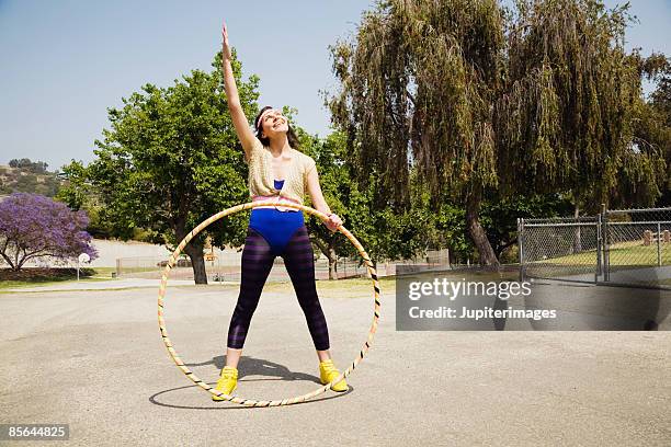 woman with plastic hoop - hooping stock pictures, royalty-free photos & images