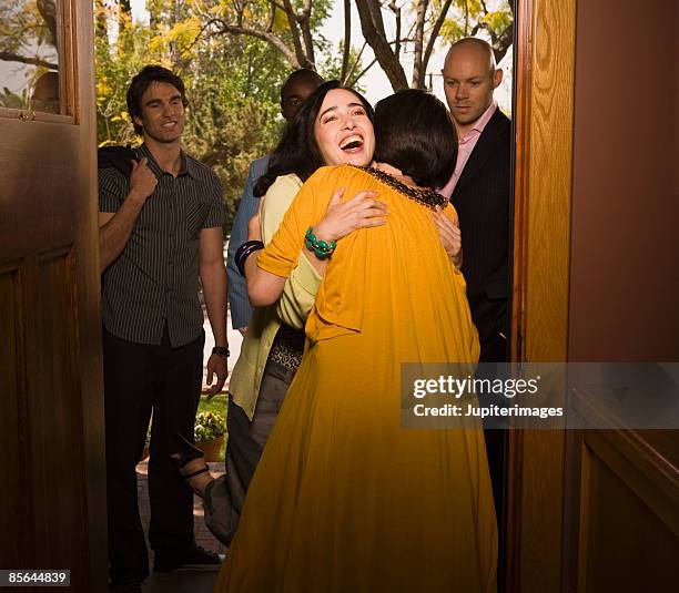 two friends embracing - affectionate stock pictures, royalty-free photos & images