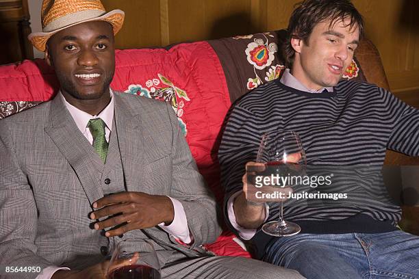 two men at party - man fedora room stock pictures, royalty-free photos & images