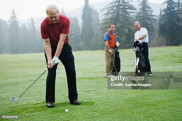 men playing golf - bad golf swing stock pictures, royalty-free photos & images