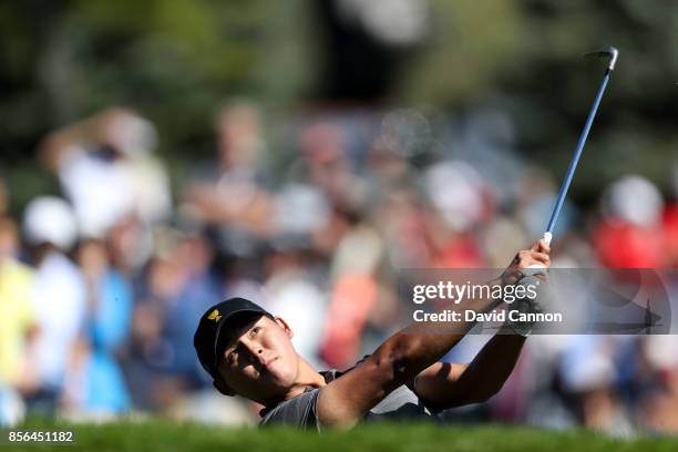 Si Woo Kim of South Korea and the International team plays his second shot on the first hole in his match against Daniel Berger of the United States...