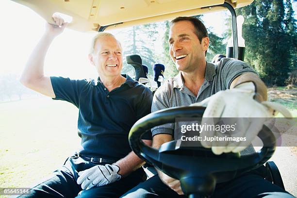 men driving golf cart - sport golf stock pictures, royalty-free photos & images