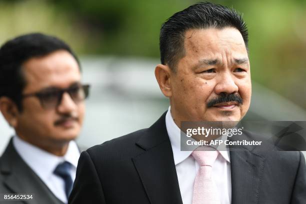 Indonesia's ambassador to Malaysia Rusdi Kirana walks towards journalists at the Shah Alam High Court compound during the trial for Indonesian...