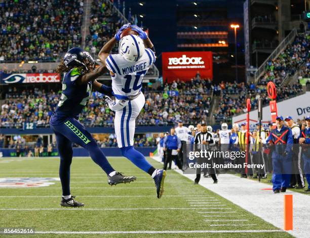 Wide receiver Donte Moncrief of the Indianapolis Colts beats cornerback Shaquill Griffin of the Seattle Seahawks to score an 18 yard touchdown in the...