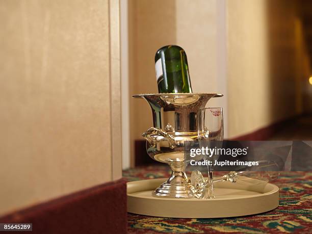 champagne on room service tray - room service stock pictures, royalty-free photos & images