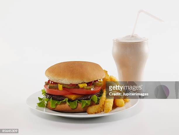 cheeseburger , french fries , and milkshake - cheeseburger and fries stock-fotos und bilder