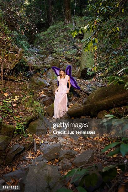 woman in woods wearing fairy costume - wingwalking stock pictures, royalty-free photos & images