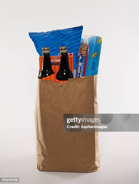 bag of junk food groceries - salzkekse stock-fotos und bilder